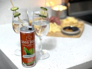 Sparkling Cucumber Lime Gimlet Good Dogg Cocktail next to a can of Good Dogg.